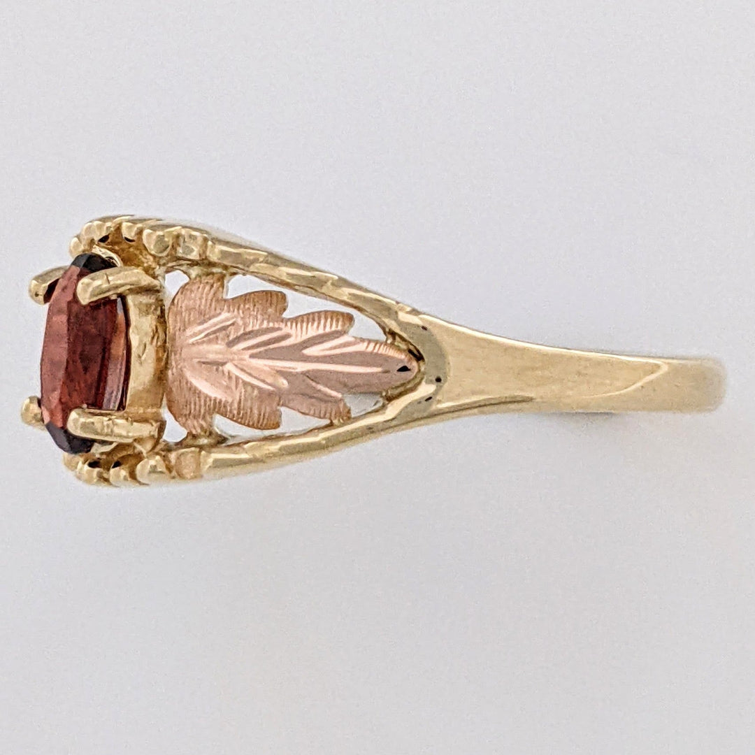 10K TWO-TONE GARNET OVAL 4X6 WITH ROSE LEAF ESTATE RING 2.2 GRAMS