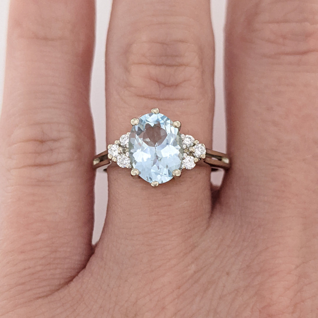 14K WHITE AQUAMARINE "AA" OVAL 7X9 WITH .12 DIAMOND TOTAL WEIGHT ESTATE RING 3.0 GRAMS
