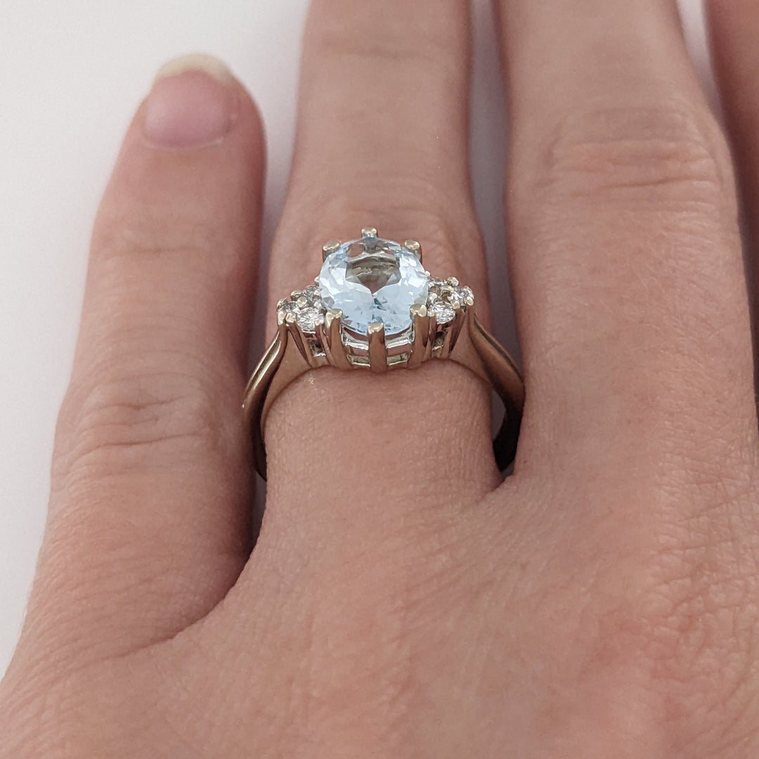 14K WHITE AQUAMARINE "AA" OVAL 7X9 WITH .12 DIAMOND TOTAL WEIGHT ESTATE RING 3.0 GRAMS