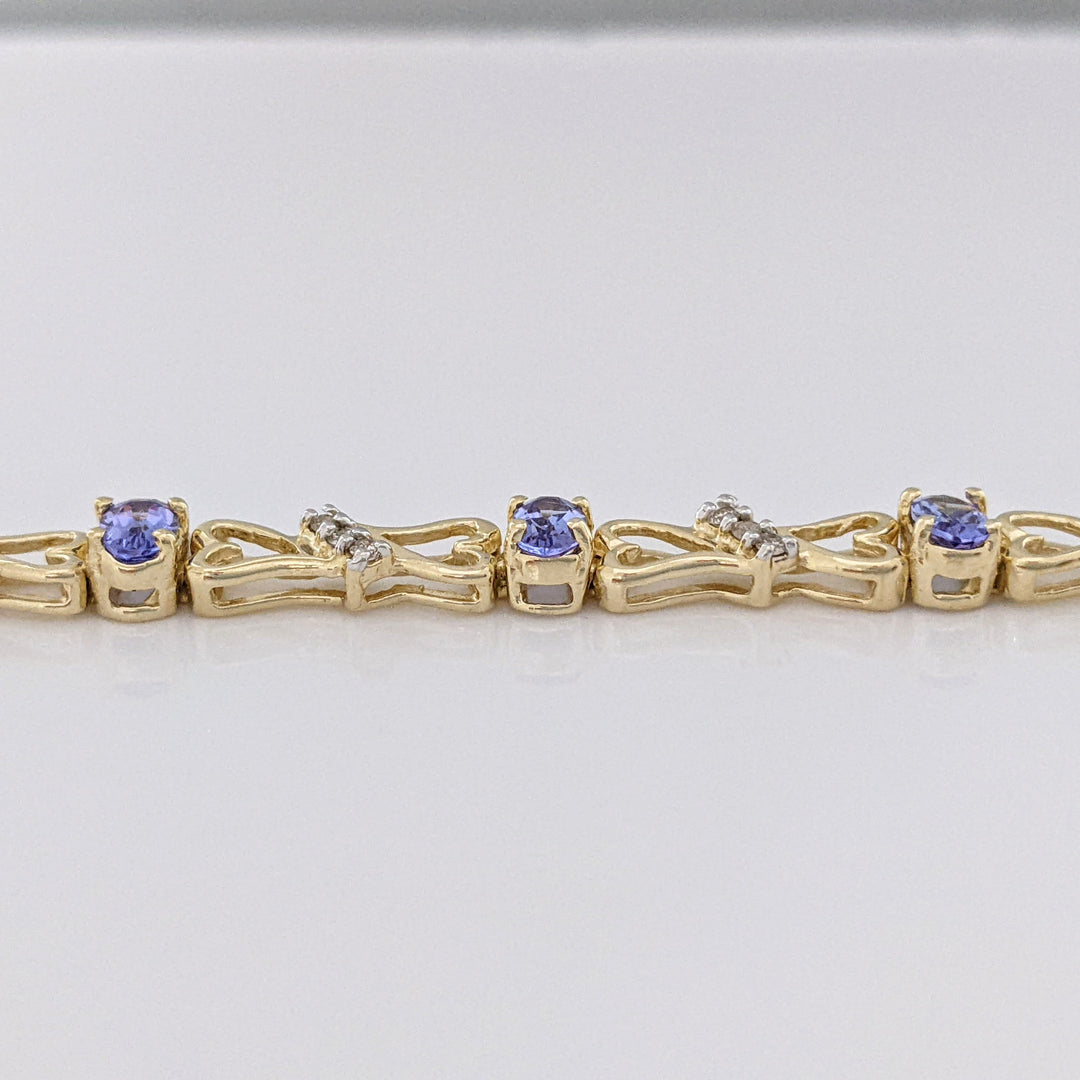14K TANZANITE OVAL (11) 3X5 WITH .33 DIAMOND TOTAL WEIGHT (33) ESTATE BRACELET 10.5 GRAMS