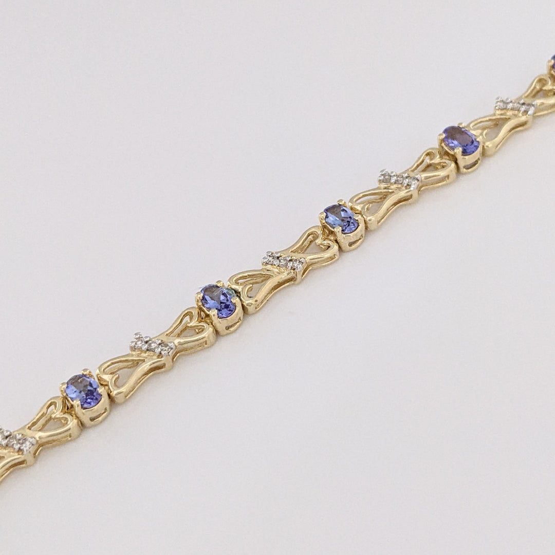 14K TANZANITE OVAL (11) 3X5 WITH .33 DIAMOND TOTAL WEIGHT (33) ESTATE BRACELET 10.5 GRAMS