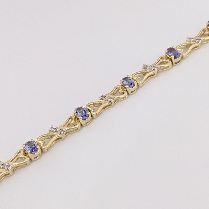 14K TANZANITE OVAL (11) 3X5 WITH .33 DIAMOND TOTAL WEIGHT (33) ESTATE BRACELET 10.5 GRAMS