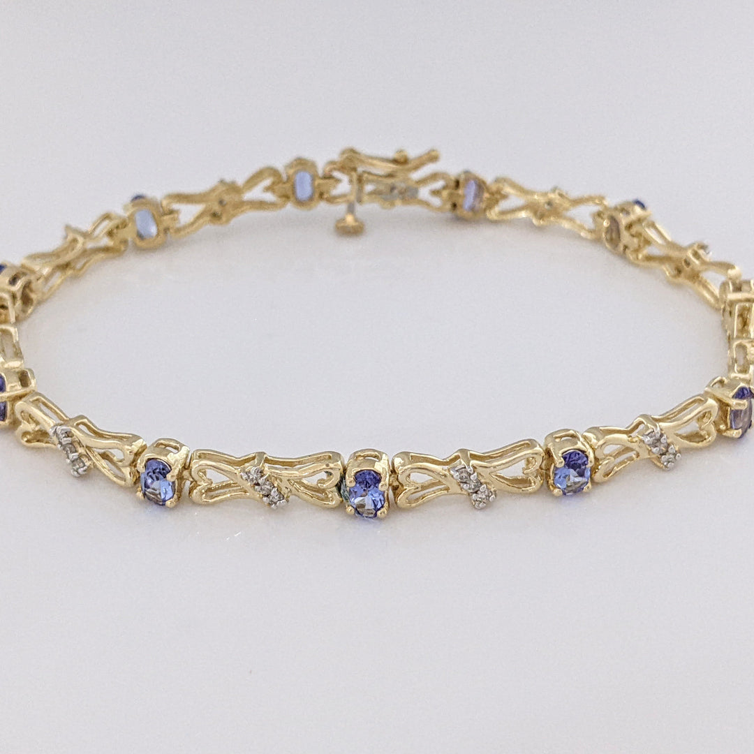 14K TANZANITE OVAL (11) 3X5 WITH .33 DIAMOND TOTAL WEIGHT (33) ESTATE BRACELET 10.5 GRAMS