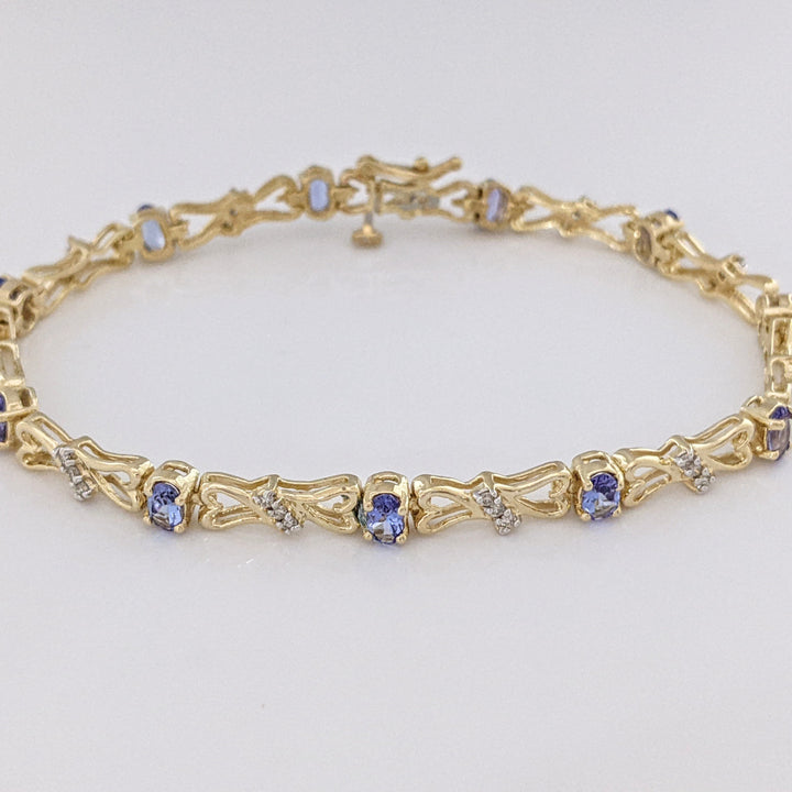 14K TANZANITE OVAL (11) 3X5 WITH .33 DIAMOND TOTAL WEIGHT (33) ESTATE BRACELET 10.5 GRAMS