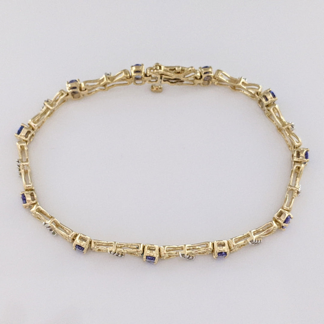 14K TANZANITE OVAL (11) 3X5 WITH .33 DIAMOND TOTAL WEIGHT (33) ESTATE BRACELET 10.5 GRAMS