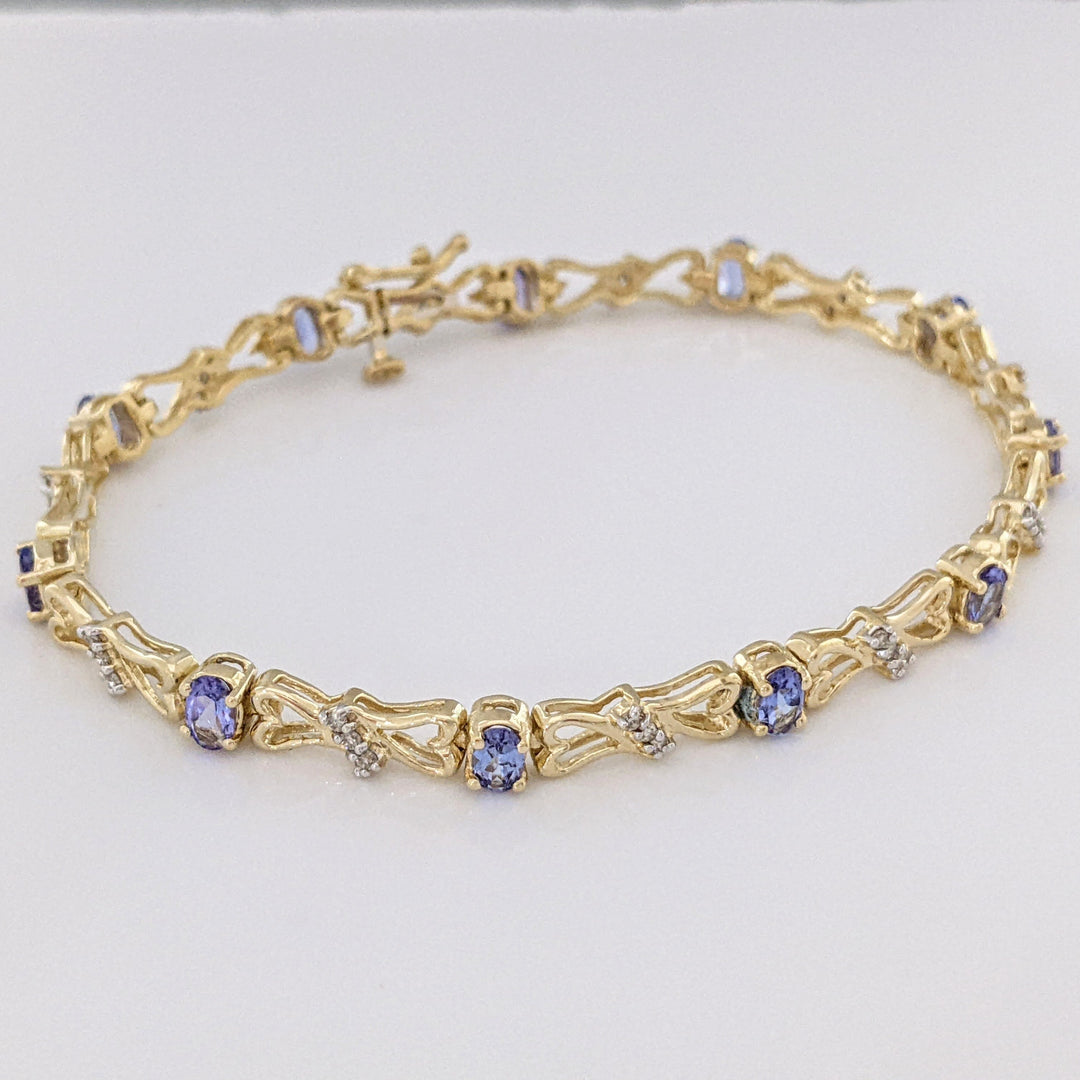 14K TANZANITE OVAL (11) 3X5 WITH .33 DIAMOND TOTAL WEIGHT (33) ESTATE BRACELET 10.5 GRAMS
