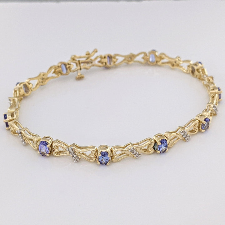 14K TANZANITE OVAL (11) 3X5 WITH .33 DIAMOND TOTAL WEIGHT (33) ESTATE BRACELET 10.5 GRAMS