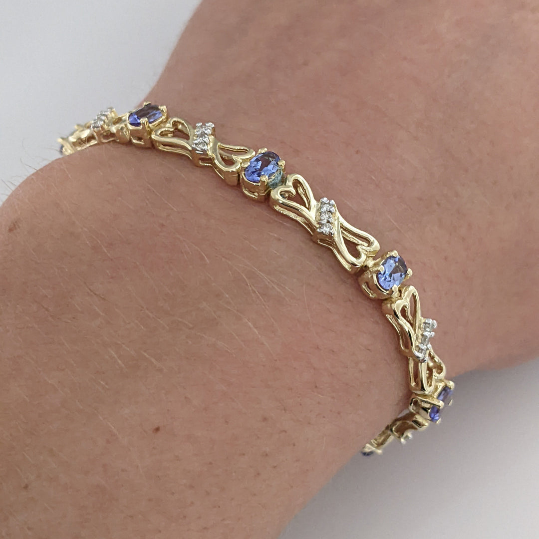 14K TANZANITE OVAL (11) 3X5 WITH .33 DIAMOND TOTAL WEIGHT (33) ESTATE BRACELET 10.5 GRAMS