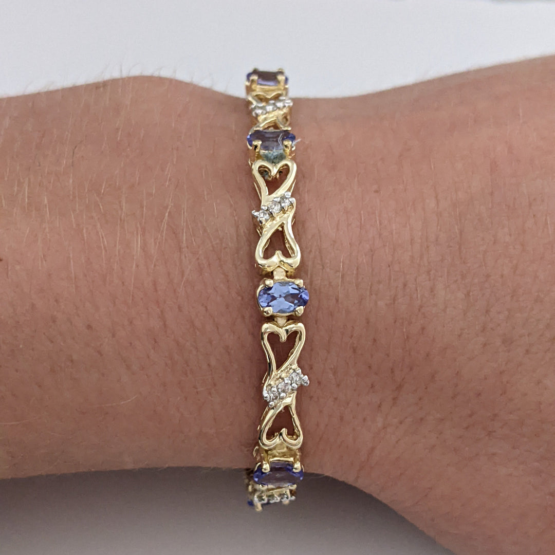 14K TANZANITE OVAL (11) 3X5 WITH .33 DIAMOND TOTAL WEIGHT (33) ESTATE BRACELET 10.5 GRAMS