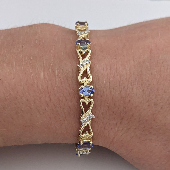 14K TANZANITE OVAL (11) 3X5 WITH .33 DIAMOND TOTAL WEIGHT (33) ESTATE BRACELET 10.5 GRAMS