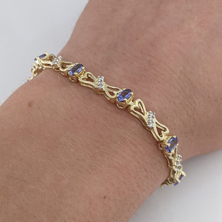 14K TANZANITE OVAL (11) 3X5 WITH .33 DIAMOND TOTAL WEIGHT (33) ESTATE BRACELET 10.5 GRAMS
