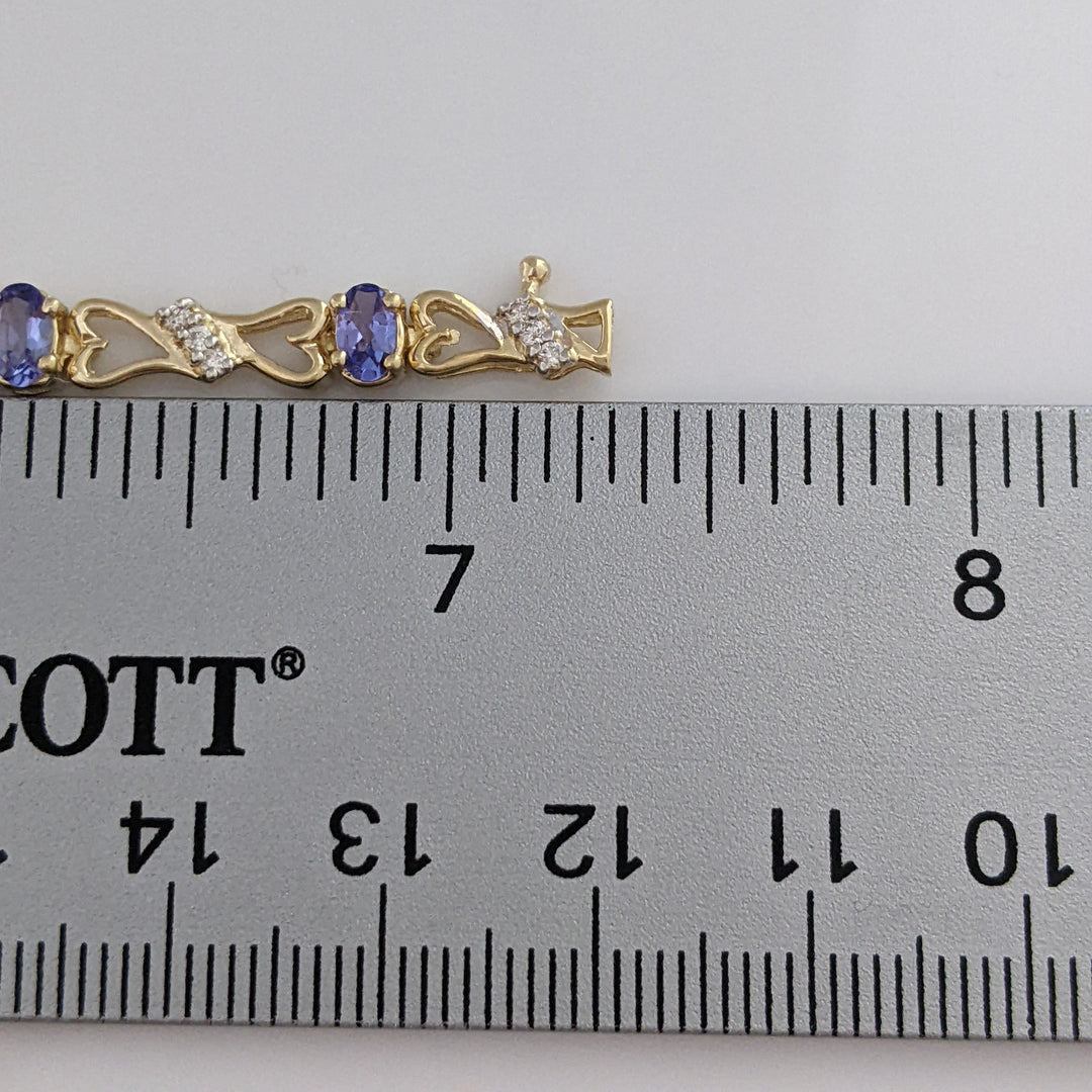 14K TANZANITE OVAL (11) 3X5 WITH .33 DIAMOND TOTAL WEIGHT (33) ESTATE BRACELET 10.5 GRAMS