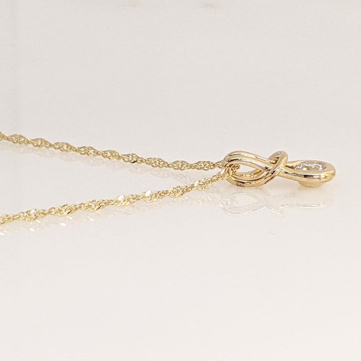 14K .16 CARAT TOTAL VS1 I DIAMOND ROUND LOVE KNOT ESTATE PENDANT & CHAIN 1.9 GRAMS