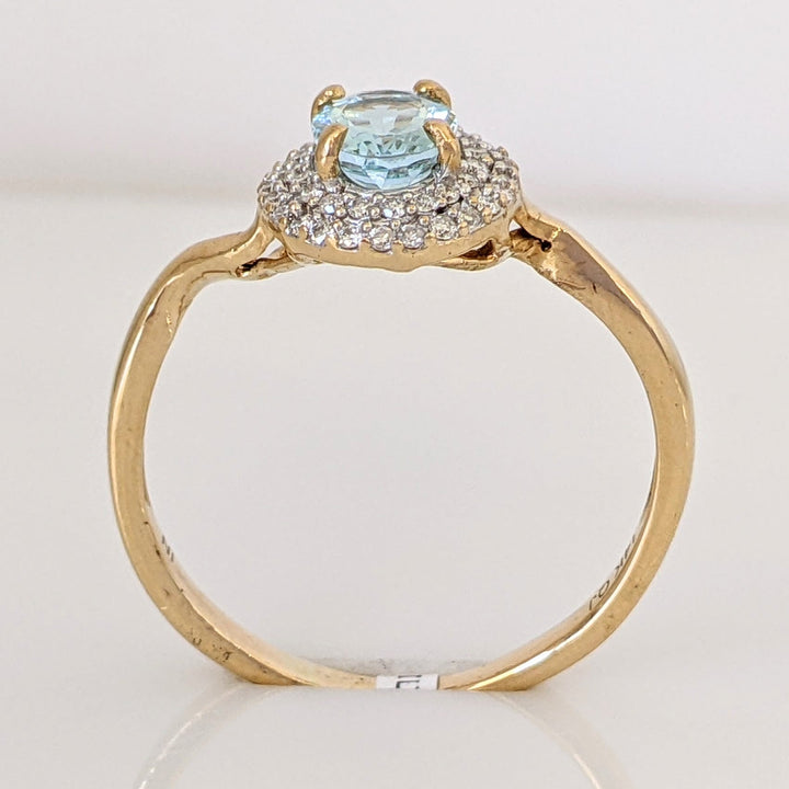 14K AQUAMARINE OVAL 5X7 WITH .23 DIAMOND TOTAL WEIGHT ESTATE HALO RING 2.5 GRAMS
