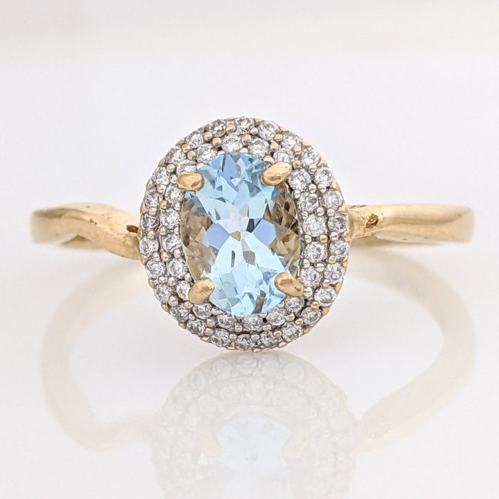 14K AQUAMARINE OVAL 5X7 WITH .23 DIAMOND TOTAL WEIGHT ESTATE HALO RING 2.5 GRAMS