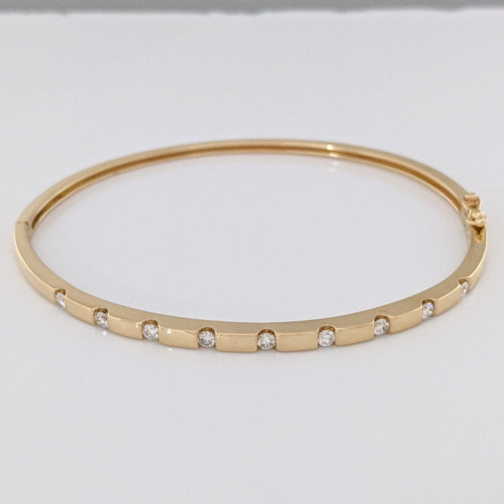 14K .36 CARAT TOTAL WEIGHT I1 I DIAMOND ROUND (9) TENSION SET ESTATE BANGLE 9.0 GRAMS