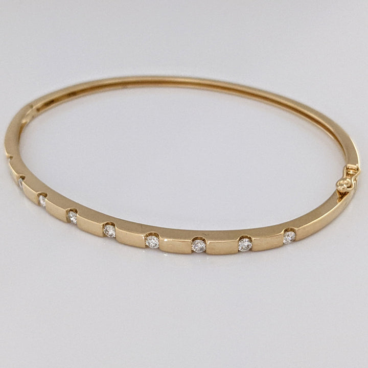 14K .36 CARAT TOTAL WEIGHT I1 I DIAMOND ROUND (9) TENSION SET ESTATE BANGLE 9.0 GRAMS