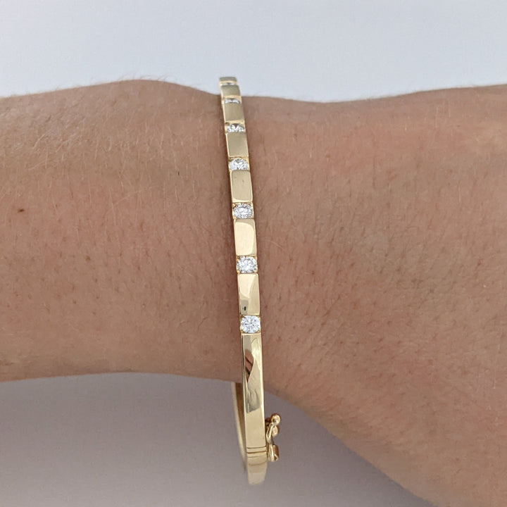 14K .36 CARAT TOTAL WEIGHT I1 I DIAMOND ROUND (9) TENSION SET ESTATE BANGLE 9.0 GRAMS