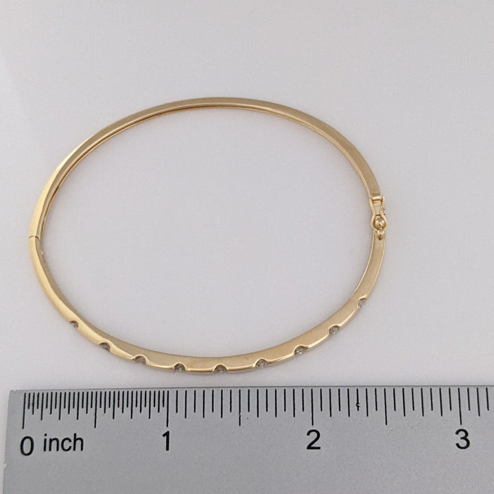 14K .36 CARAT TOTAL WEIGHT I1 I DIAMOND ROUND (9) TENSION SET ESTATE BANGLE 9.0 GRAMS