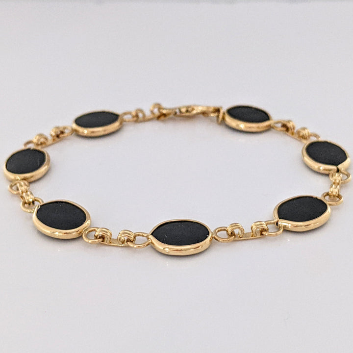 14K ONYX OVAL 7X10 (7) ESTATE BRACELET 7.1 GRAMS