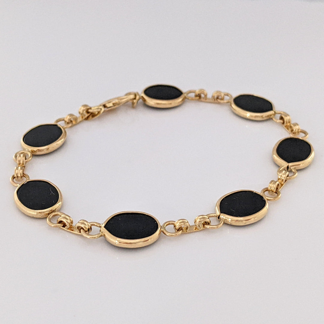 14K ONYX OVAL 7X10 (7) ESTATE BRACELET 7.1 GRAMS