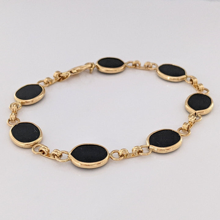 14K ONYX OVAL 7X10 (7) ESTATE BRACELET 7.1 GRAMS