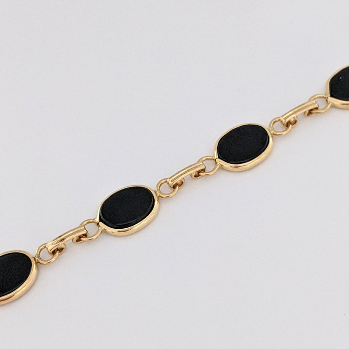 14K ONYX OVAL 7X10 (7) ESTATE BRACELET 7.1 GRAMS