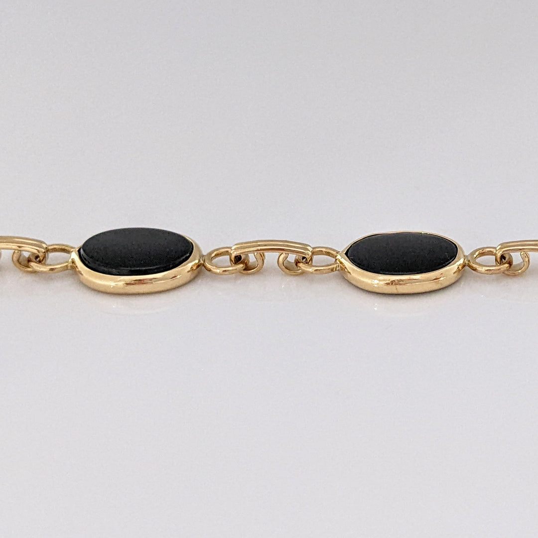 14K ONYX OVAL 7X10 (7) ESTATE BRACELET 7.1 GRAMS
