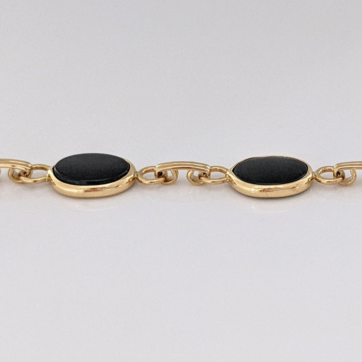 14K ONYX OVAL 7X10 (7) ESTATE BRACELET 7.1 GRAMS