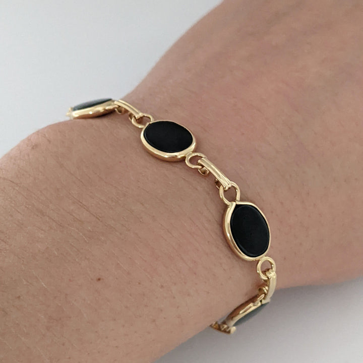 14K ONYX OVAL 7X10 (7) ESTATE BRACELET 7.1 GRAMS
