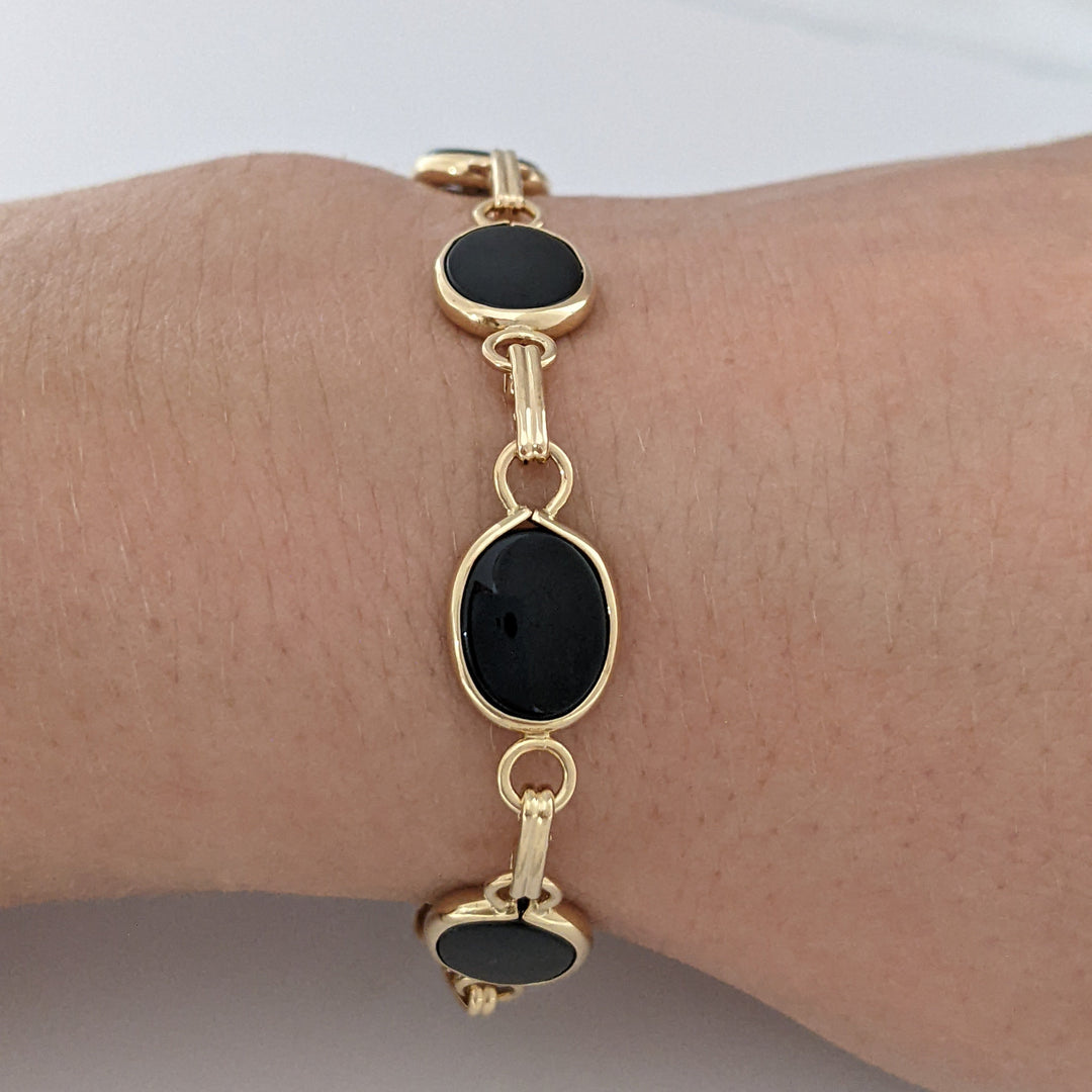 14K ONYX OVAL 7X10 (7) ESTATE BRACELET 7.1 GRAMS