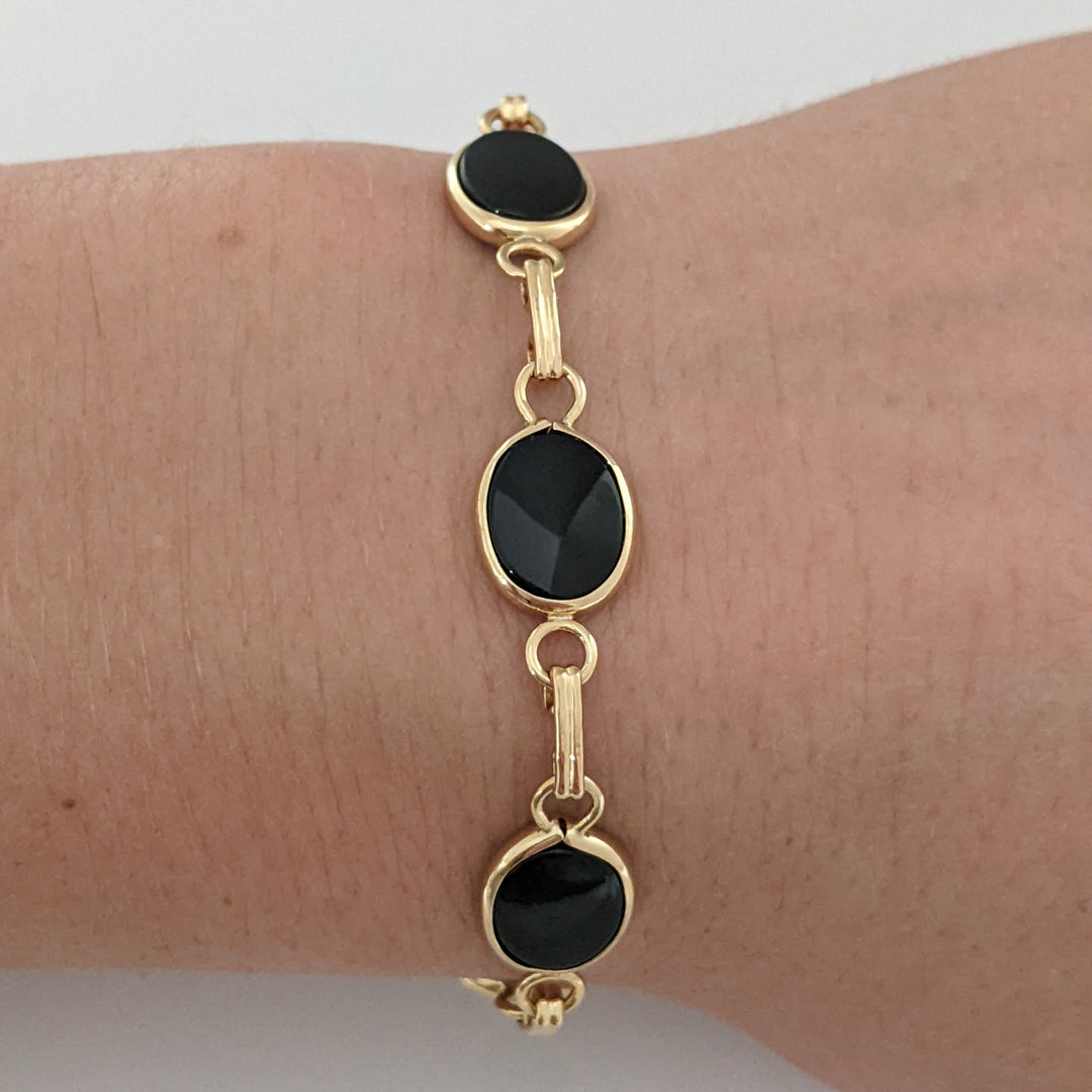 14K ONYX OVAL 7X10 (7) ESTATE BRACELET 7.1 GRAMS