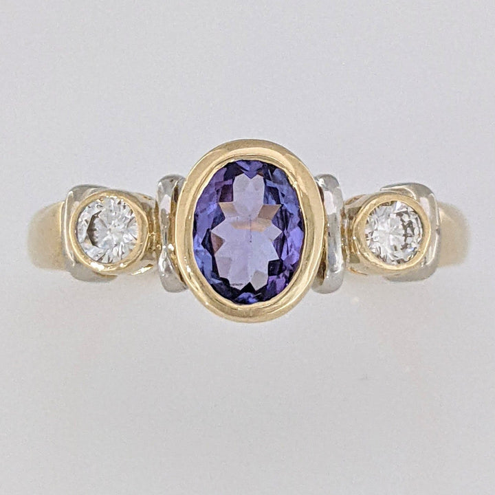 14K TANZANITE OVAL 5X7 BEZEL SET WITH .18 DIAMOND TOTAL WEIGHT ESTATE RING 5.1 GRAMS