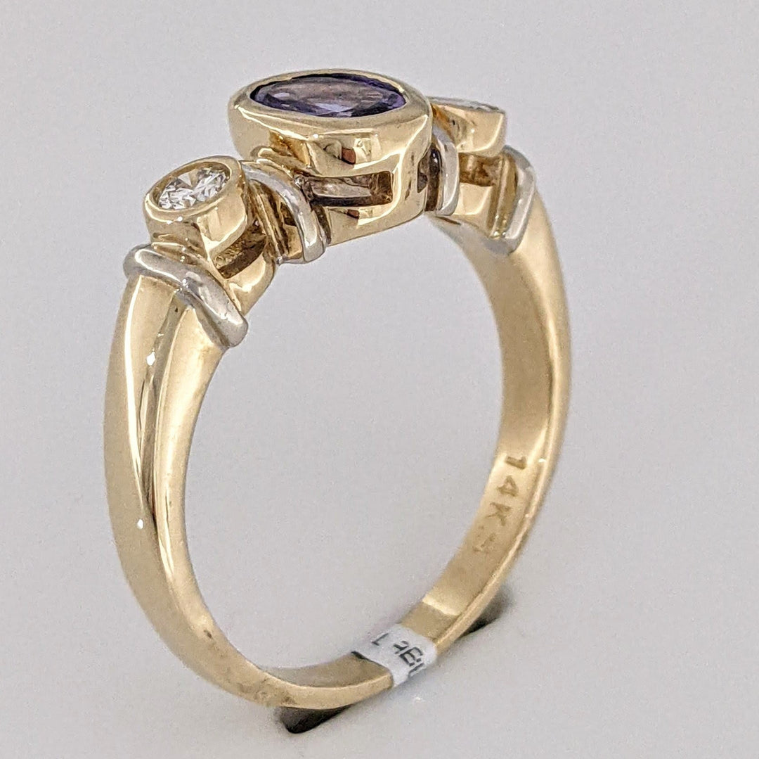 14K TANZANITE OVAL 5X7 BEZEL SET WITH .18 DIAMOND TOTAL WEIGHT ESTATE RING 5.1 GRAMS