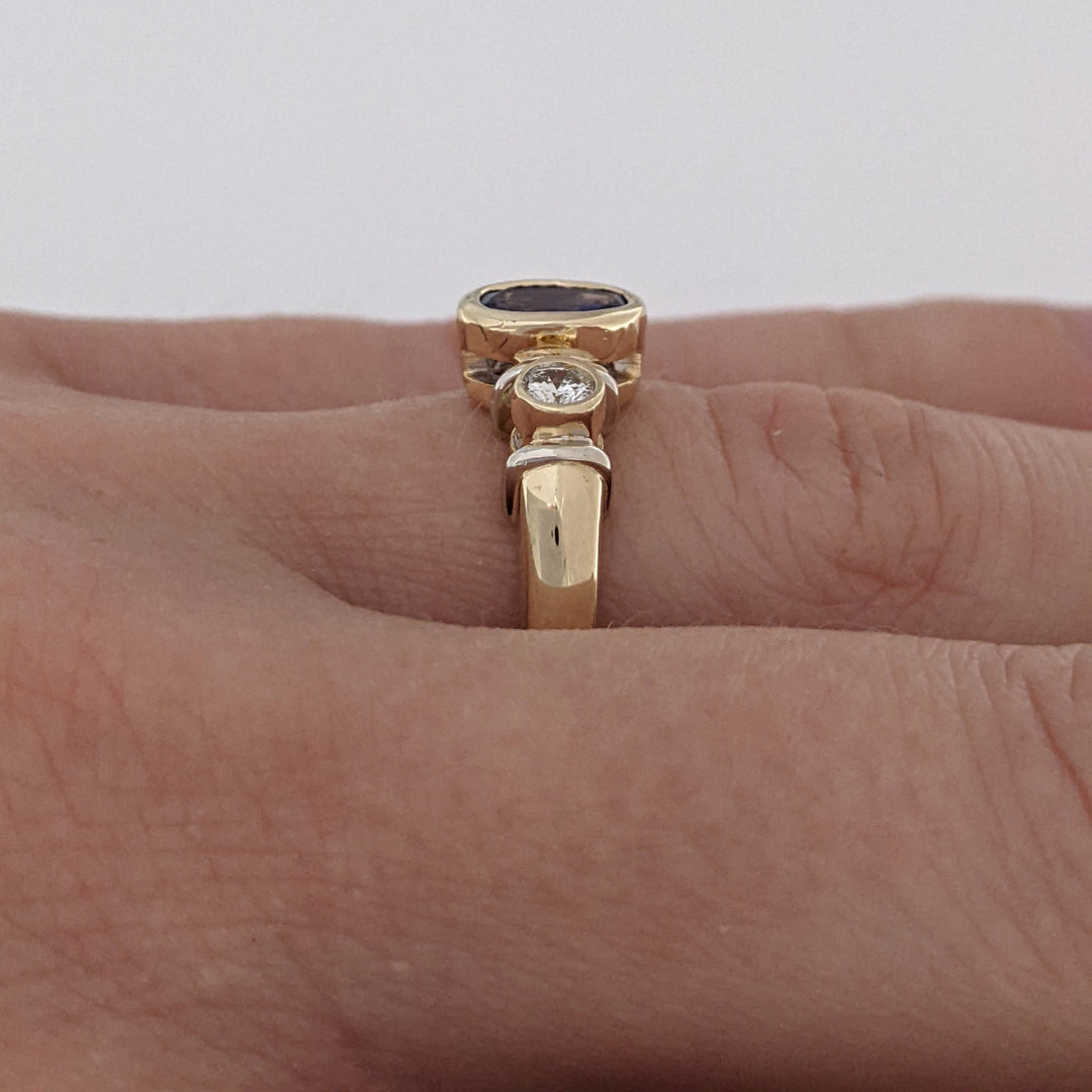 14K TANZANITE OVAL 5X7 BEZEL SET WITH .18 DIAMOND TOTAL WEIGHT ESTATE RING 5.1 GRAMS