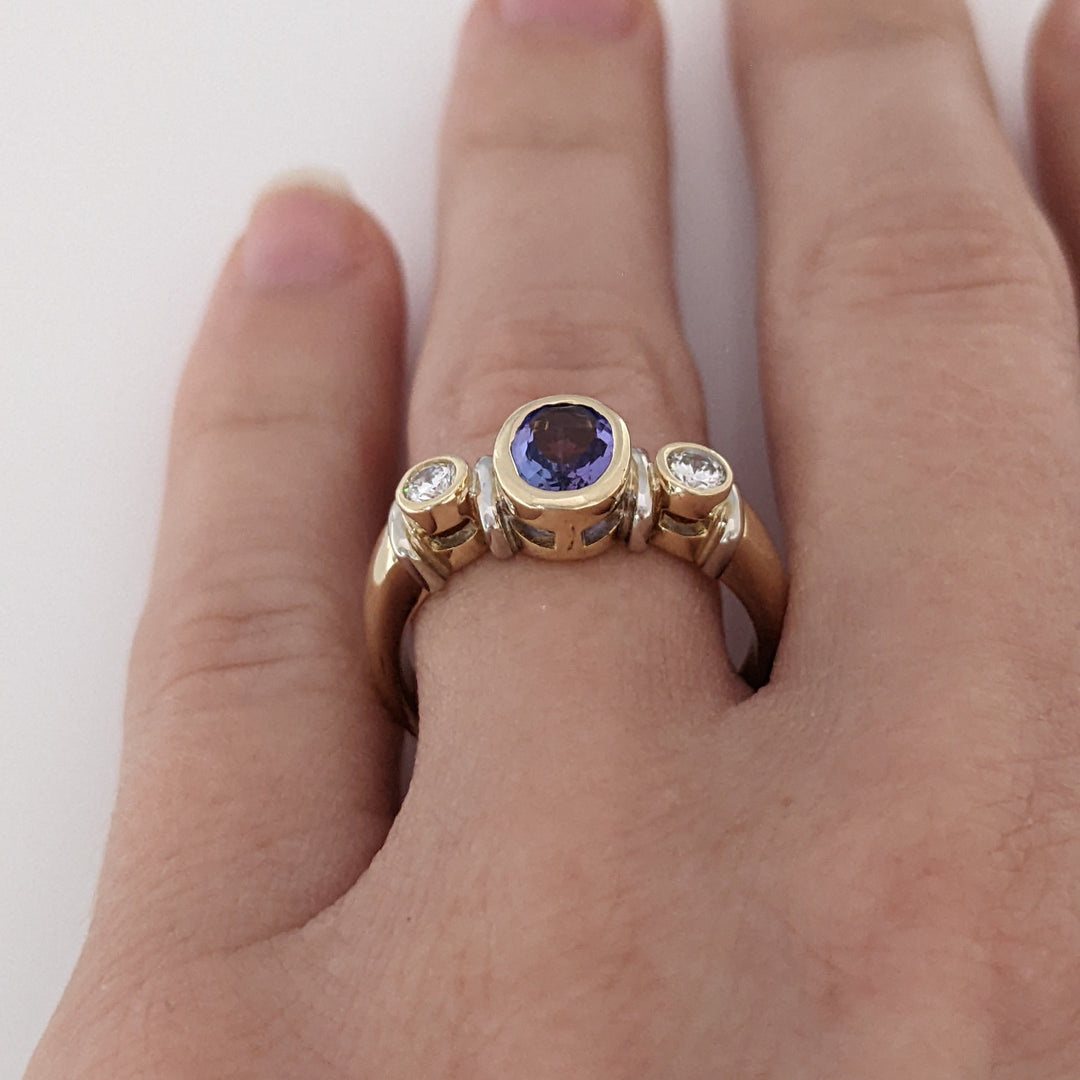 14K TANZANITE OVAL 5X7 BEZEL SET WITH .18 DIAMOND TOTAL WEIGHT ESTATE RING 5.1 GRAMS