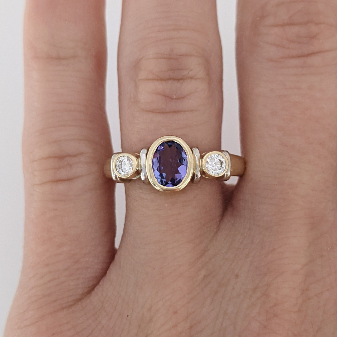 14K TANZANITE OVAL 5X7 BEZEL SET WITH .18 DIAMOND TOTAL WEIGHT ESTATE RING 5.1 GRAMS