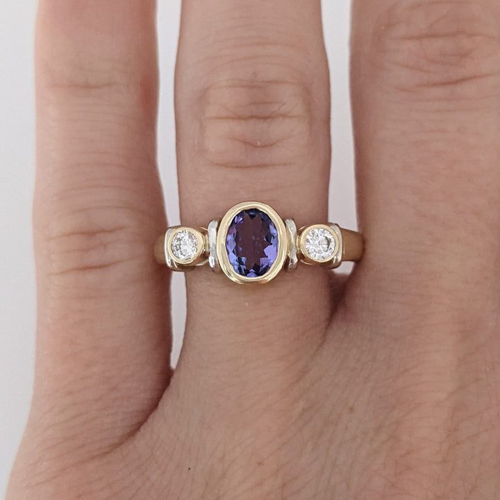 14K TANZANITE OVAL 5X7 BEZEL SET WITH .18 DIAMOND TOTAL WEIGHT ESTATE RING 5.1 GRAMS