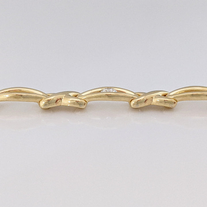 14K .12 CARAT TOTAL DIAMOND ROUND X/OVAL LINK ESTATE BRACELET 16.0 GRAMS