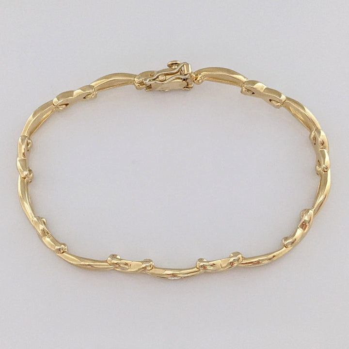 14K .12 CARAT TOTAL DIAMOND ROUND X/OVAL LINK ESTATE BRACELET 16.0 GRAMS