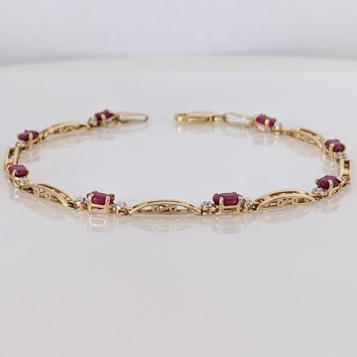 14K RUBY OVAL (8) 3X5 WITH MELEE ESTATE BRACELET 4.3 GRAMS