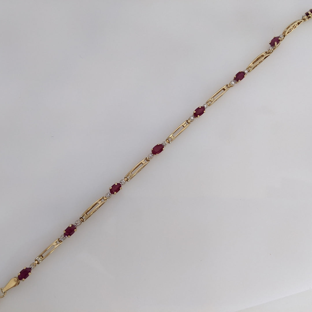 14K RUBY OVAL (8) 3X5 WITH MELEE ESTATE BRACELET 4.3 GRAMS