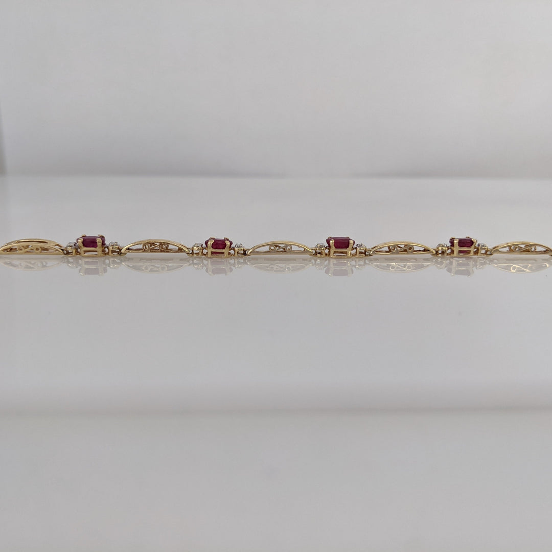 14K RUBY OVAL (8) 3X5 WITH MELEE ESTATE BRACELET 4.3 GRAMS