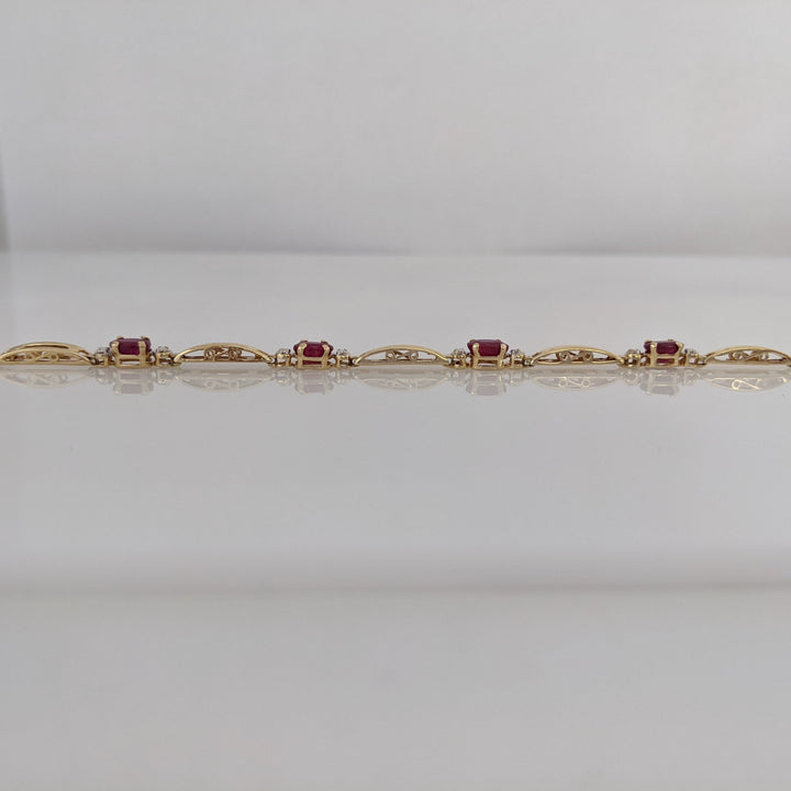 14K RUBY OVAL (8) 3X5 WITH MELEE ESTATE BRACELET 4.3 GRAMS