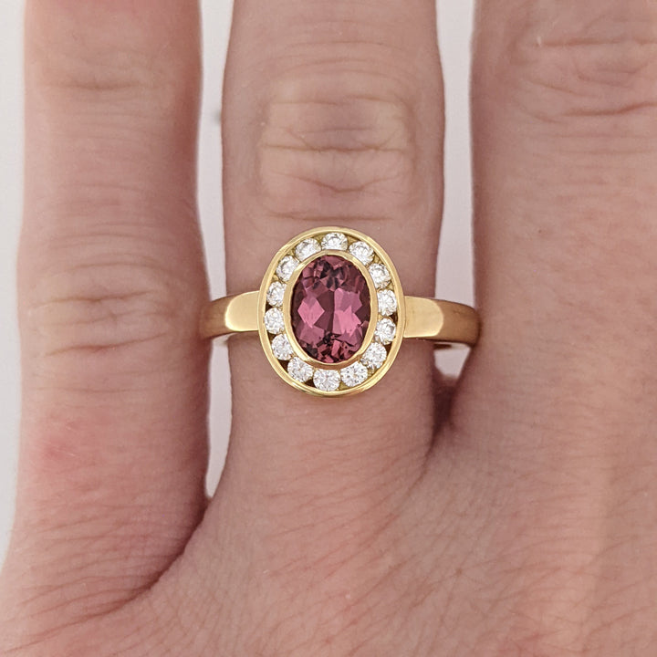 18K PINK TOURMALINE OVAL 5X7 WITH .20 DIAMOND TOTAL WEIGHT (14) ROUND HALO ESTATE RING 5.2 GRAMS