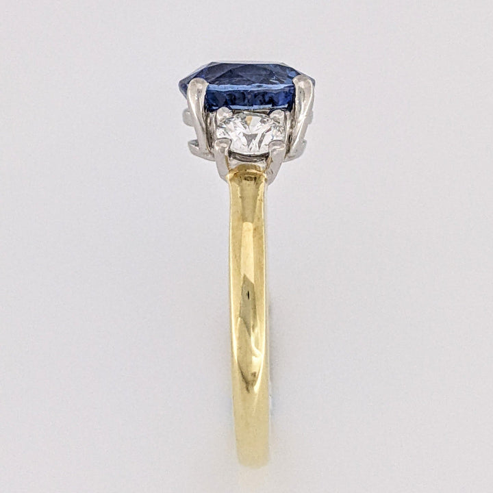 18K/PLATINUM CEYLON SAPPHIRE OVAL 7X8 WITH .45 DIAMOND TOTAL WEIGHT (2) ROUND ESTATE RING 4.3 GRAMS