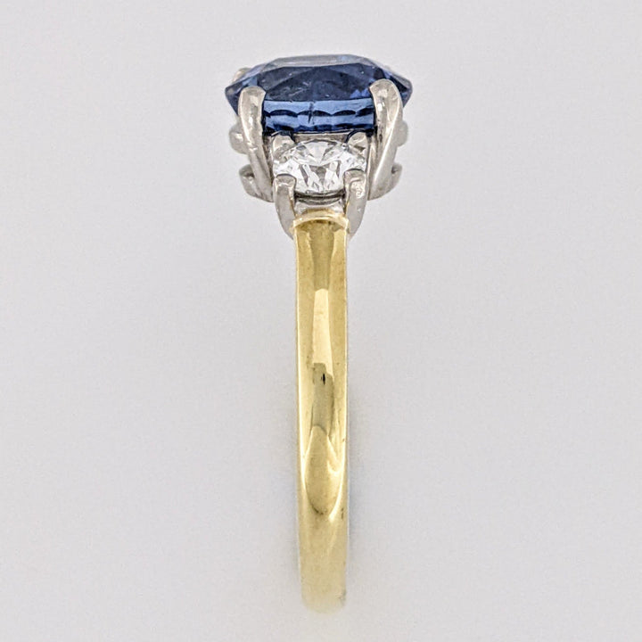 18K/PLATINUM CEYLON SAPPHIRE OVAL 7X8 WITH .45 DIAMOND TOTAL WEIGHT (2) ROUND ESTATE RING 4.3 GRAMS