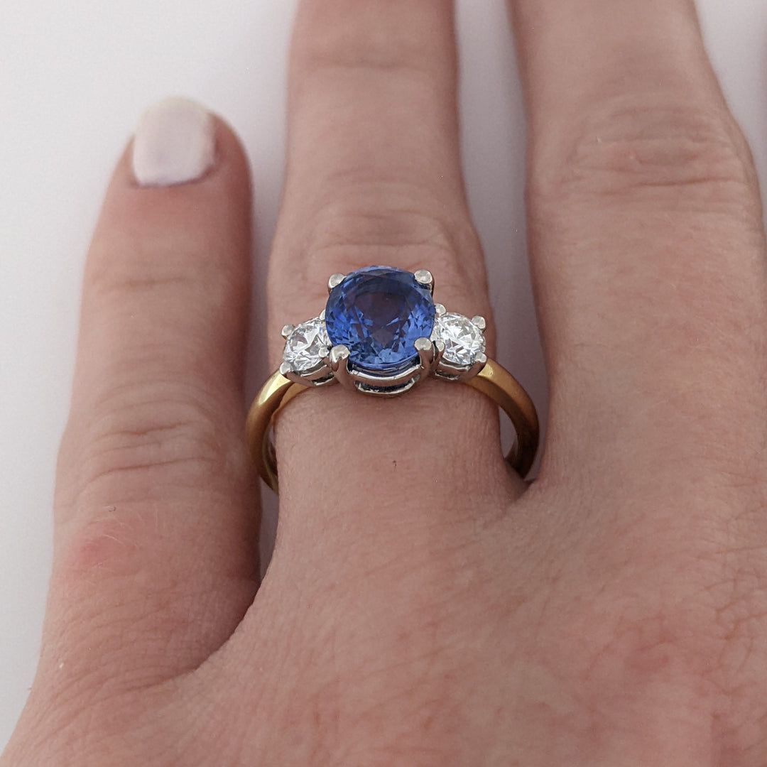 18K/PLATINUM CEYLON SAPPHIRE OVAL 7X8 WITH .45 DIAMOND TOTAL WEIGHT (2) ROUND ESTATE RING 4.3 GRAMS