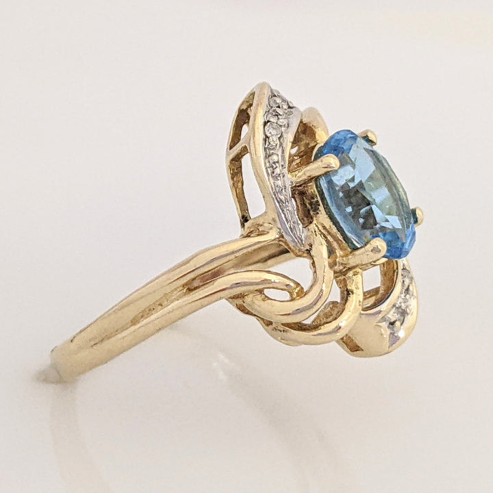 14K BLUE TOPAZ OVAL 6X8 WITH MELEE ESTATE TWIST-TOP RING 3.7 GRAMS