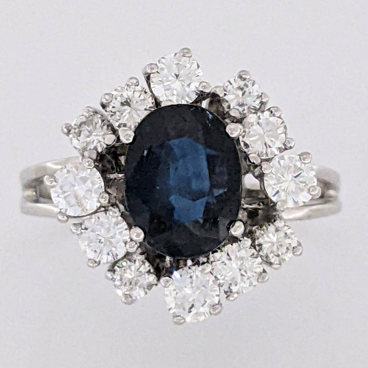 18K WHITE SAPPHIRE OVAL 6X8 WITH .76 DIAMOND TOTAL WEIGHT (12) ROUND ESTATE CLUSTER RING 4.0 GRAMS